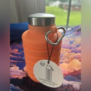 Orange Free People Movement foldable water bottle